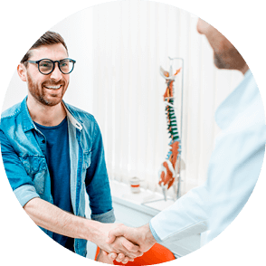 A man shaking hands with a healthcare professional